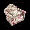 Fauteuil miniature en tissu fleuri et bois, idéal pour une maison de poupée élégante. Modèle 