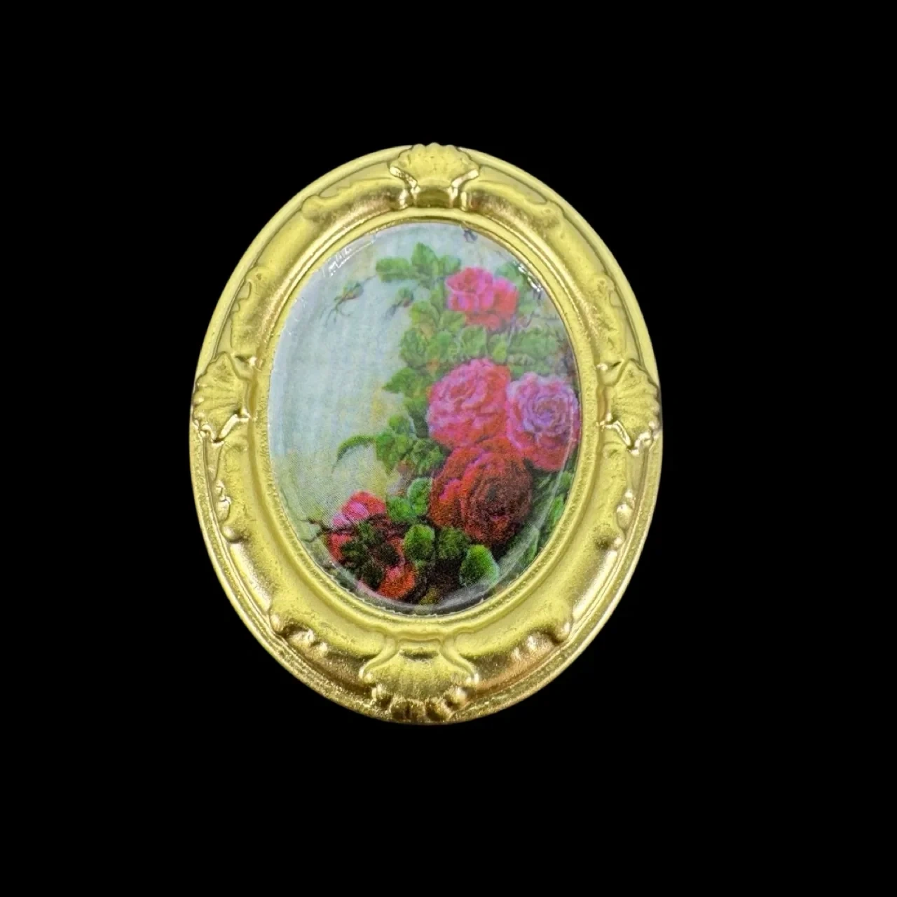 Tableau miniature ovale doré avec décor de roses sur fond noir