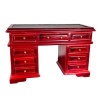Bureau miniature en acajou avec neuf tiroirs et surface en simili cuir.