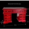 Bureau miniature en acajou avec neuf tiroirs et surface en simili cuir.