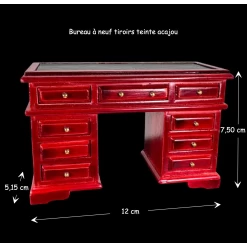 Bureau miniature en acajou avec neuf tiroirs et surface en simili cuir.
