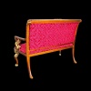 Sofa style Empire en bois de noyer et or avec tissu rouge.