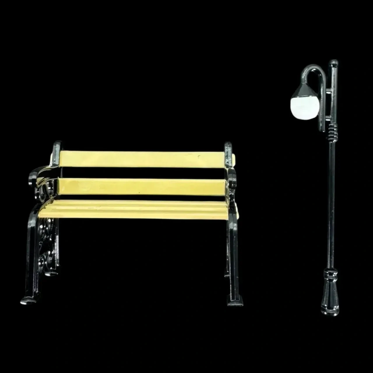 Banc et lampadaire miniatures en métal peint sur fond noir