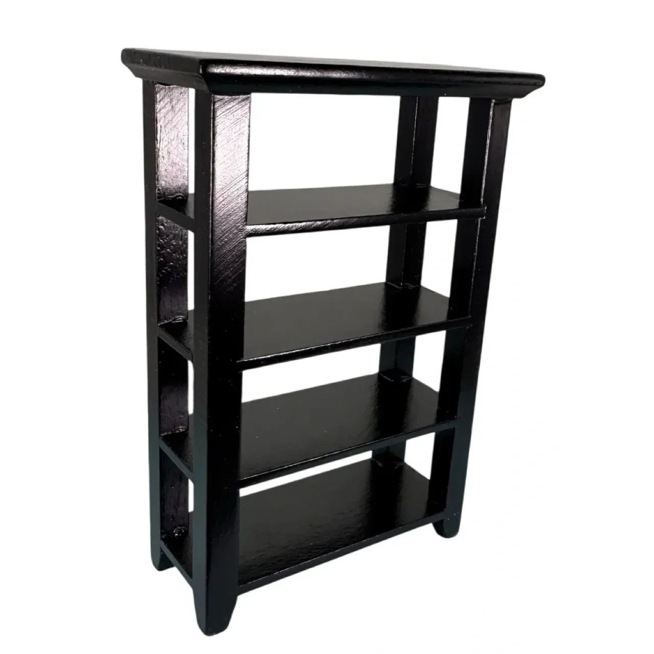 Étagère miniature en bois peint noir sur fond blanc