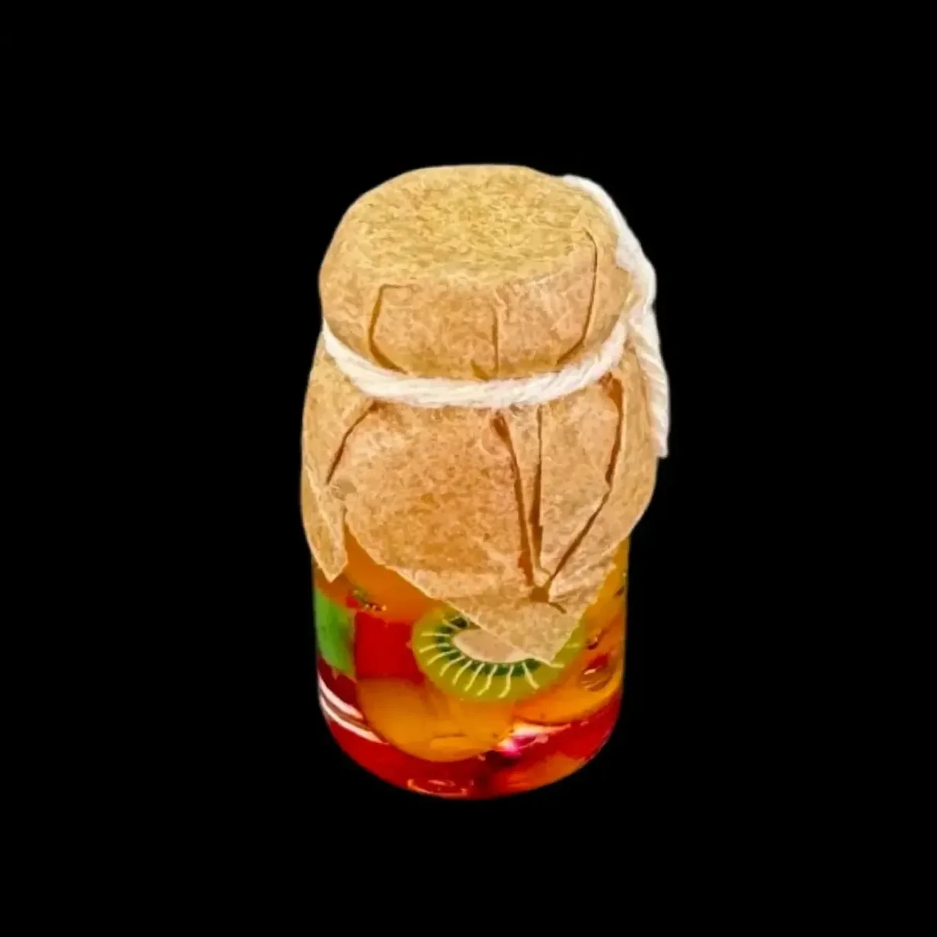 Bocal de fruits miniatures en verre avec assortiment de fruits colorés