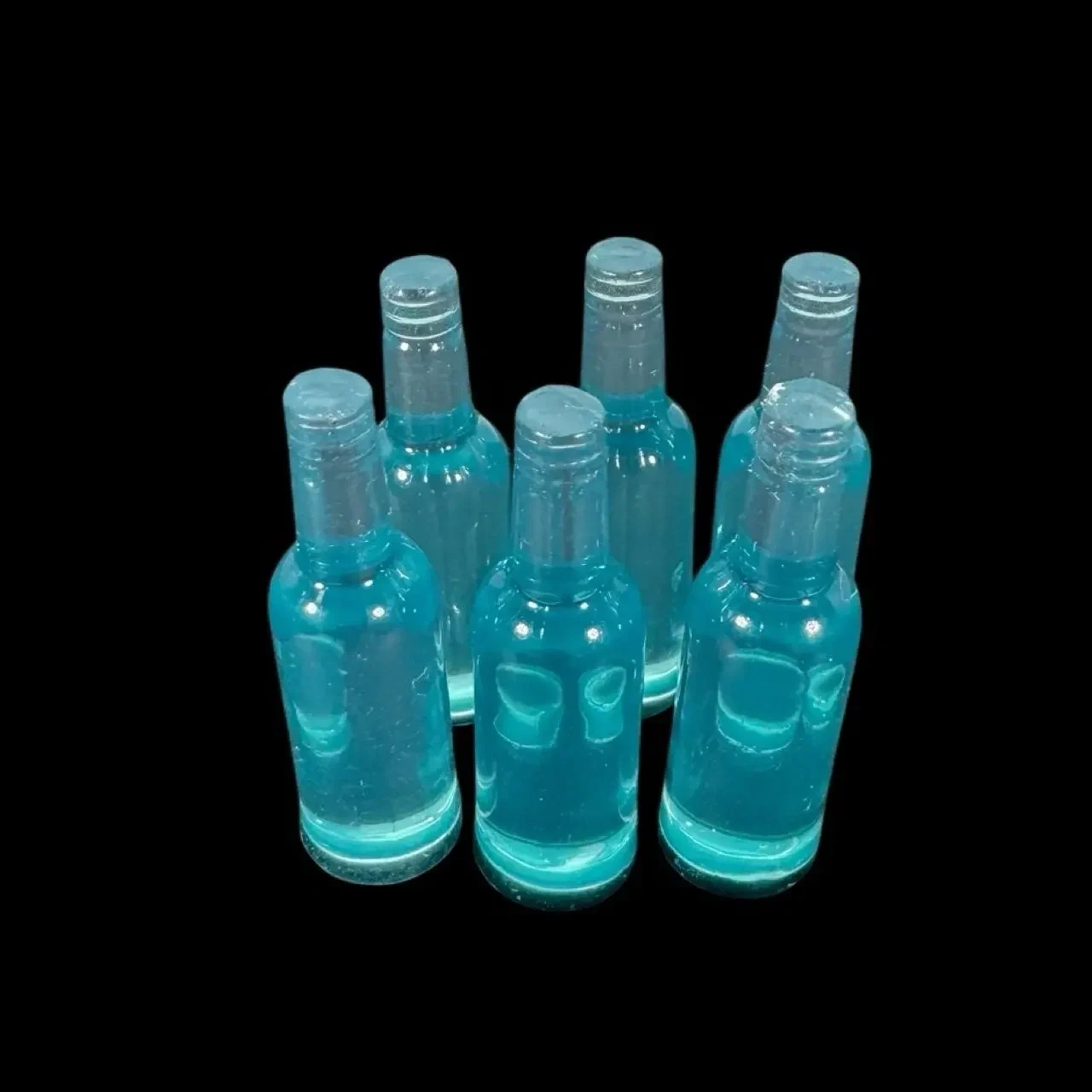 Lot de 6 bouteilles miniatures bleues en résine translucide