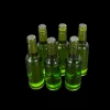 Lot de 6 bouteilles miniatures vertes en résine translucide