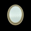 Miroir miniature ovale en métal doré vieilli