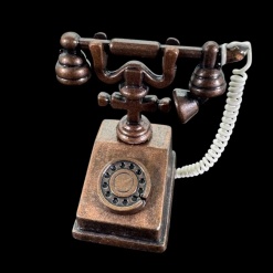 Téléphone rétro miniature en métal couleur bronze avec combiné