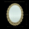 Miroir miniature ovale en métal doré avec dimensions 4,12 x 5,12 cm