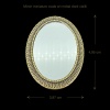 Miroir miniature ovale en métal doré vieilli dimensions 3,97 x 4,95 cm