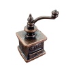 Moulin à café miniature bronze en métal avec manivelle avec fond blanc