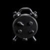 Vue arrière du réveil matin miniature noir en métal