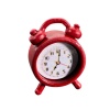 Réveil matin miniature rouge en métal sur fond blanc