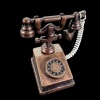 Téléphone rétro miniature bronze avec cadran et combiné amovible