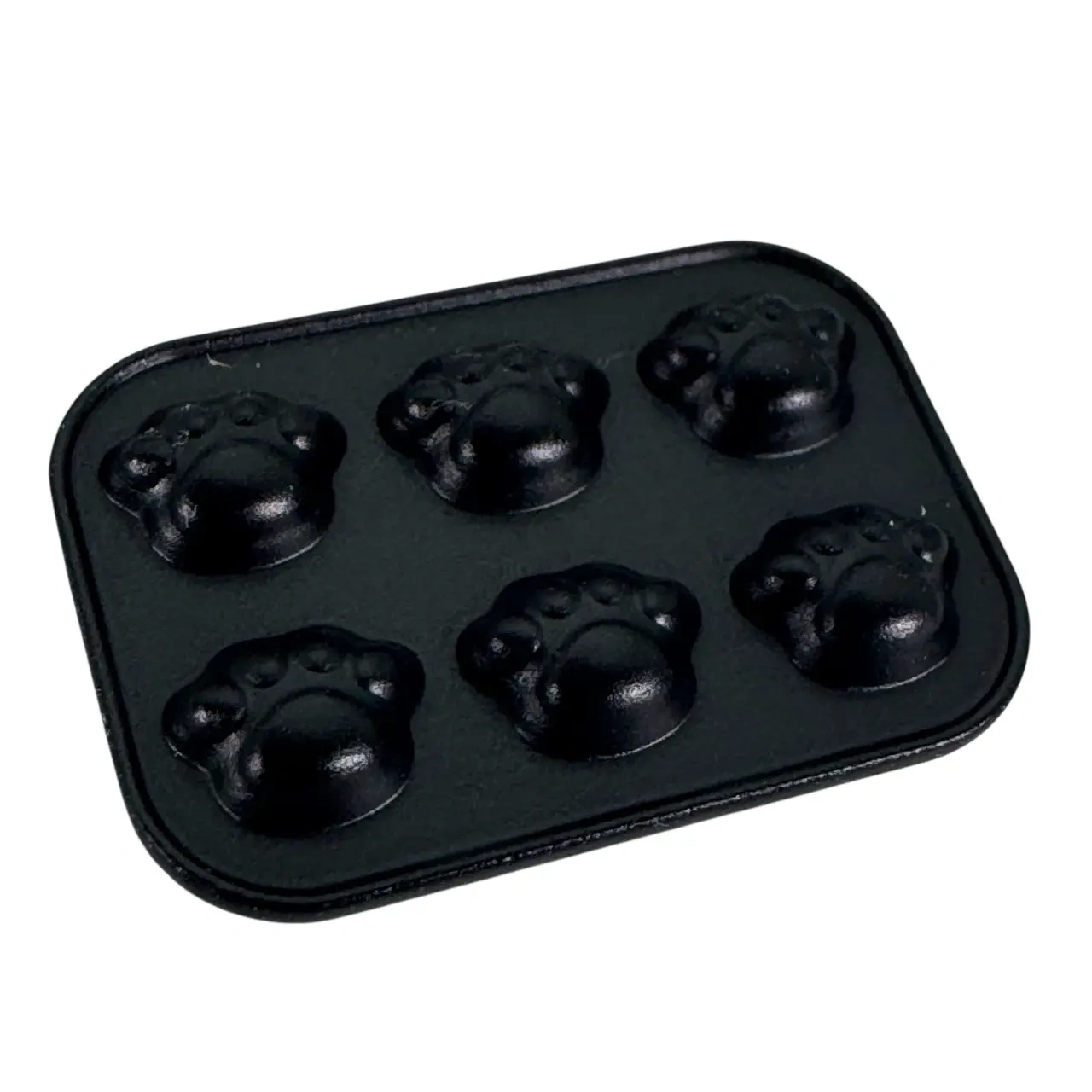 Moule à gâteaux noir miniature avec six empreintes détaillées de pattes d’ours