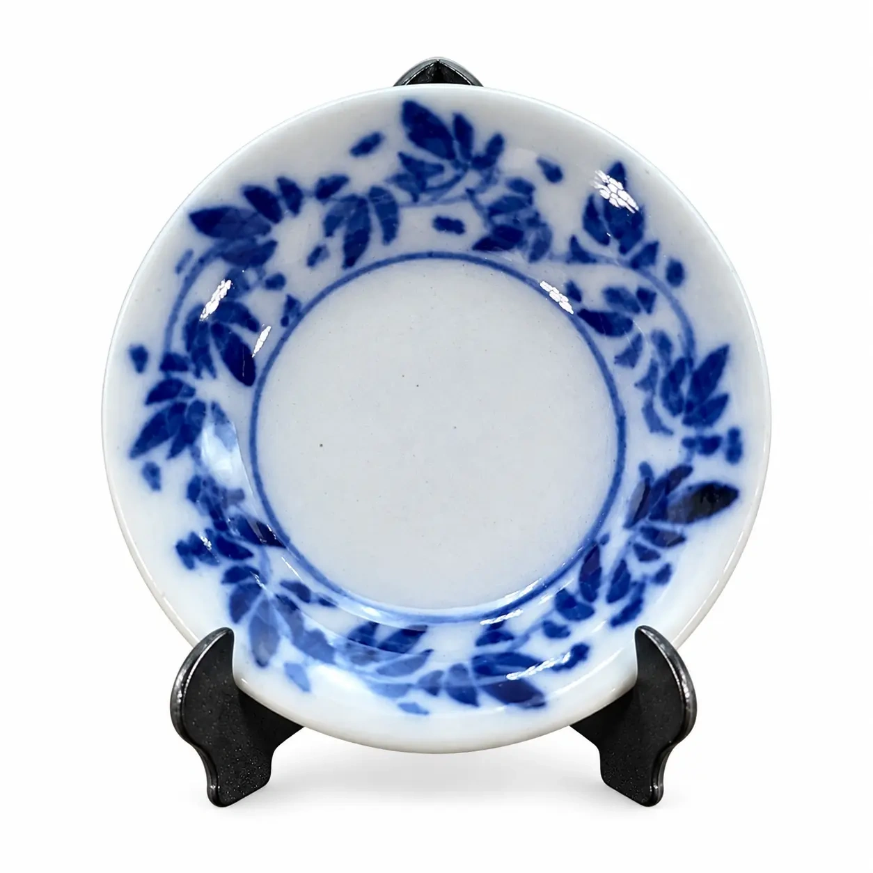 Support pour assiette miniature en métal noir vu de profil