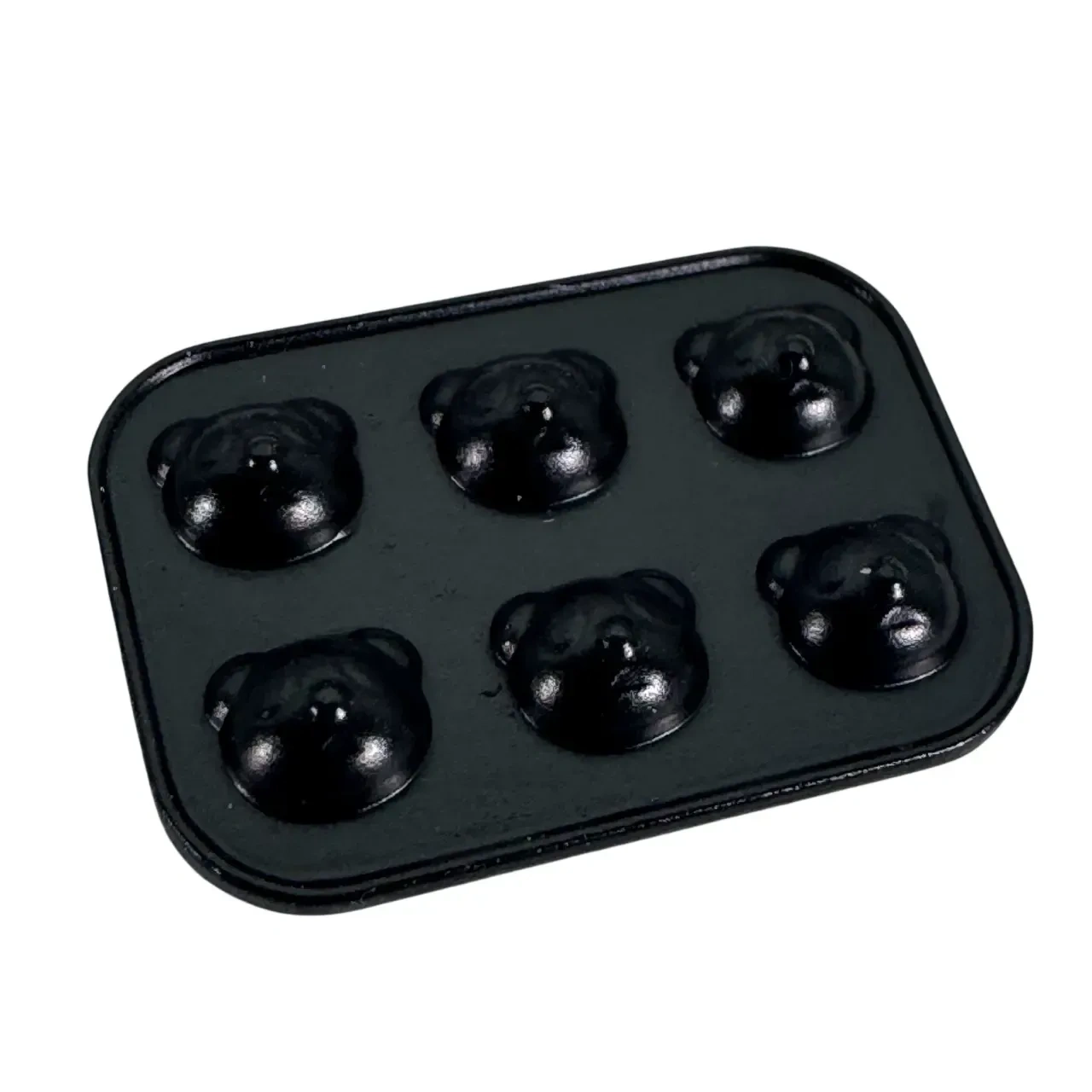 Moule miniature noir avec six empreintes en forme de tête de panda